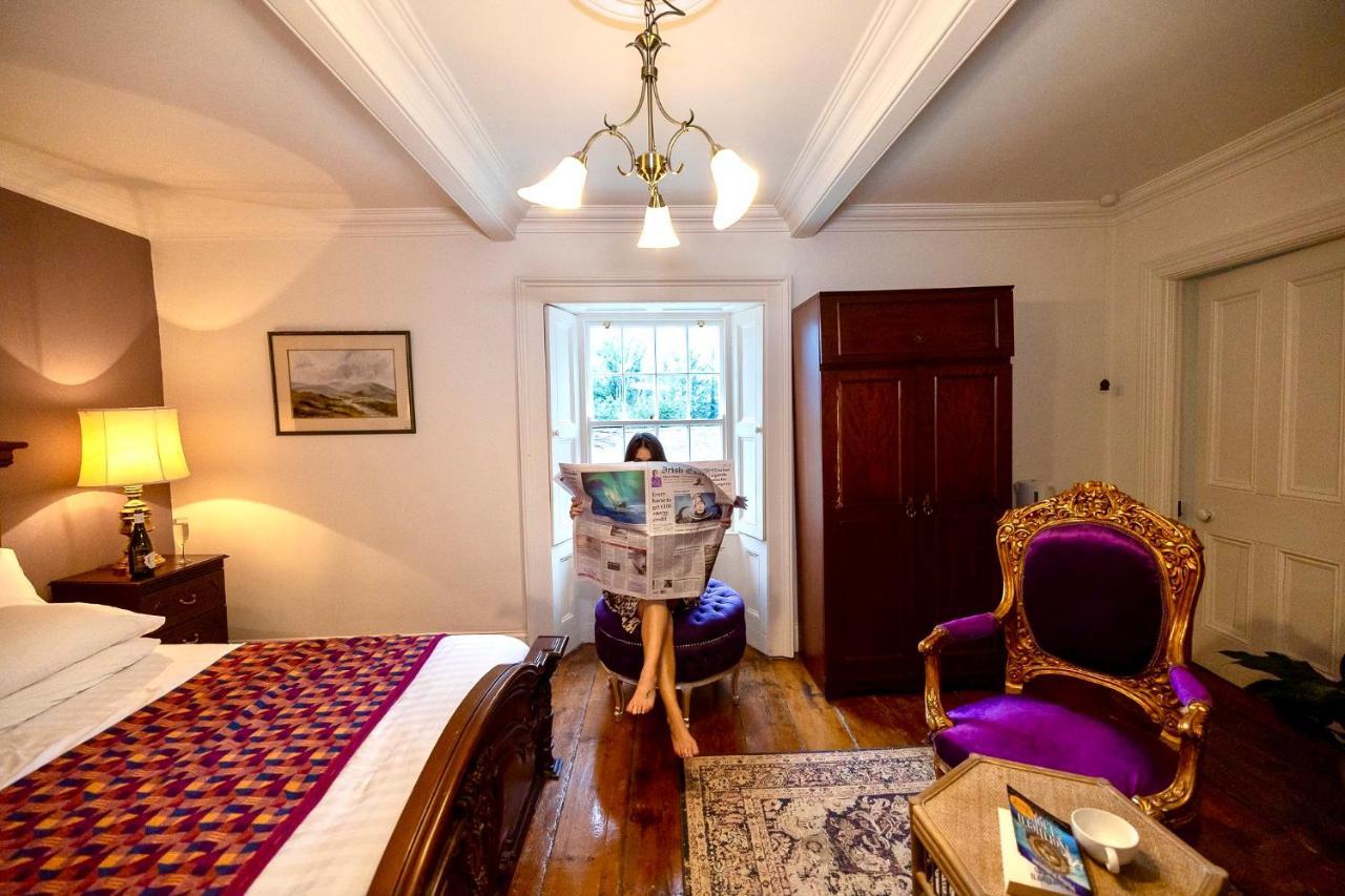 Clone Country House Охрим Экстерьер фото A guest reading the Irish Times in the hotel